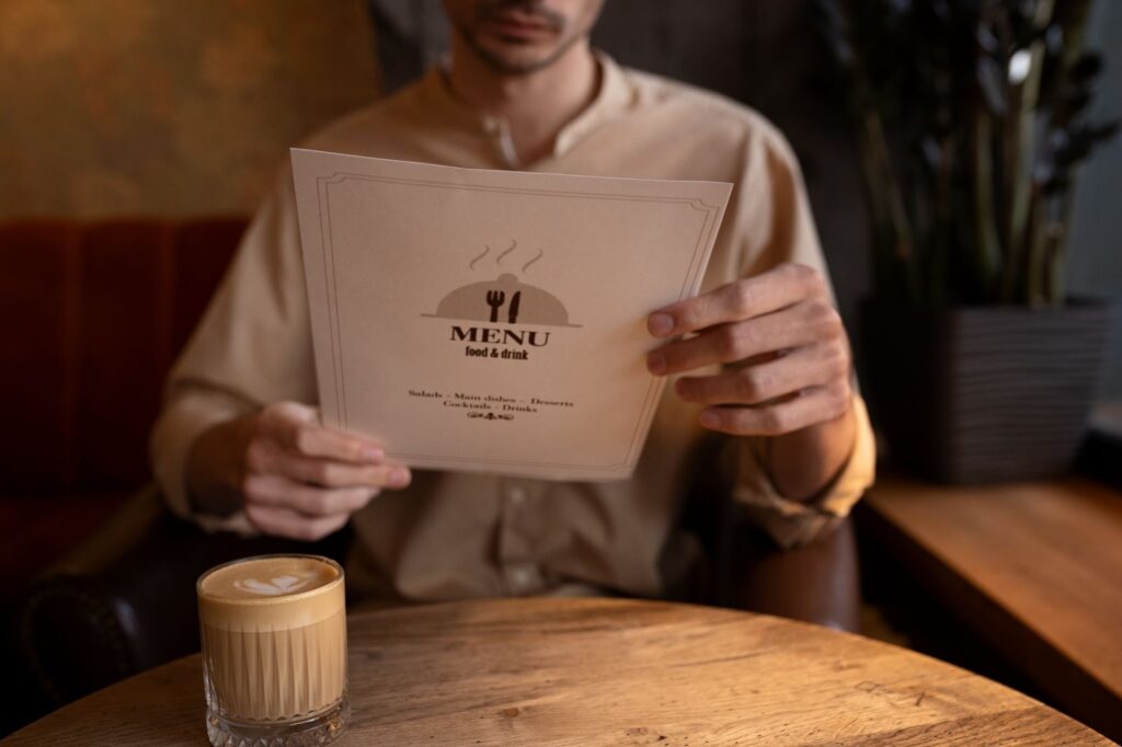 Man holding menu in his hands