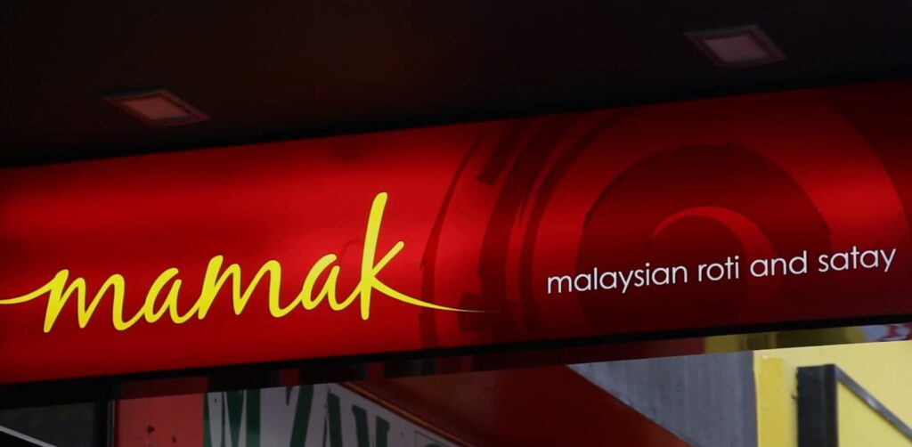 a red sign of Mamak Malaysian roti and satay food restaurant