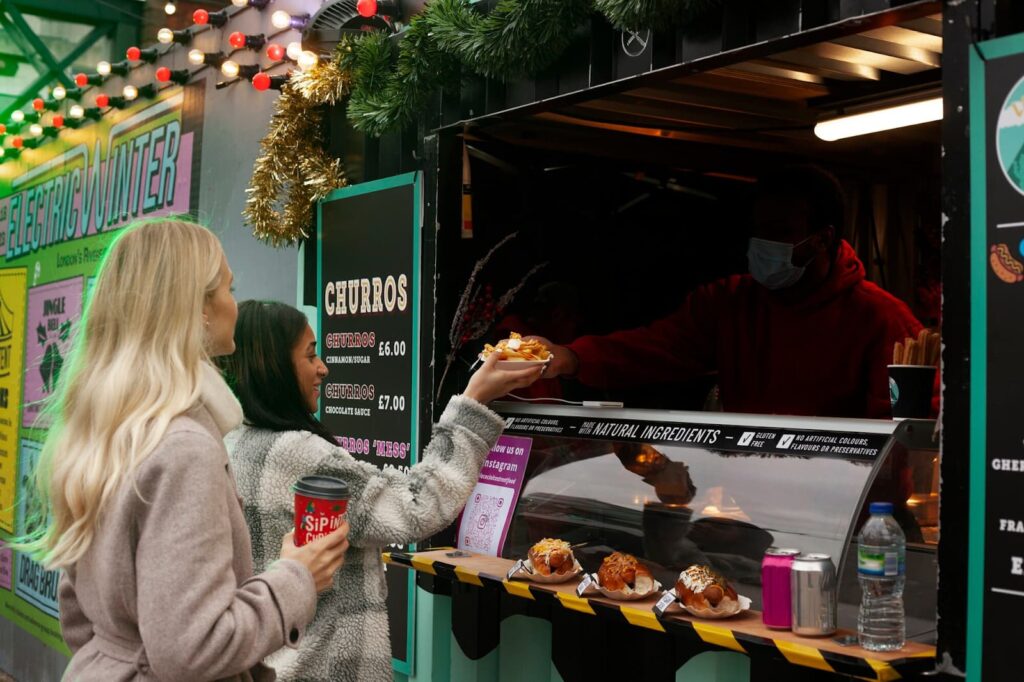 Girls order food in a restaurant on wheels