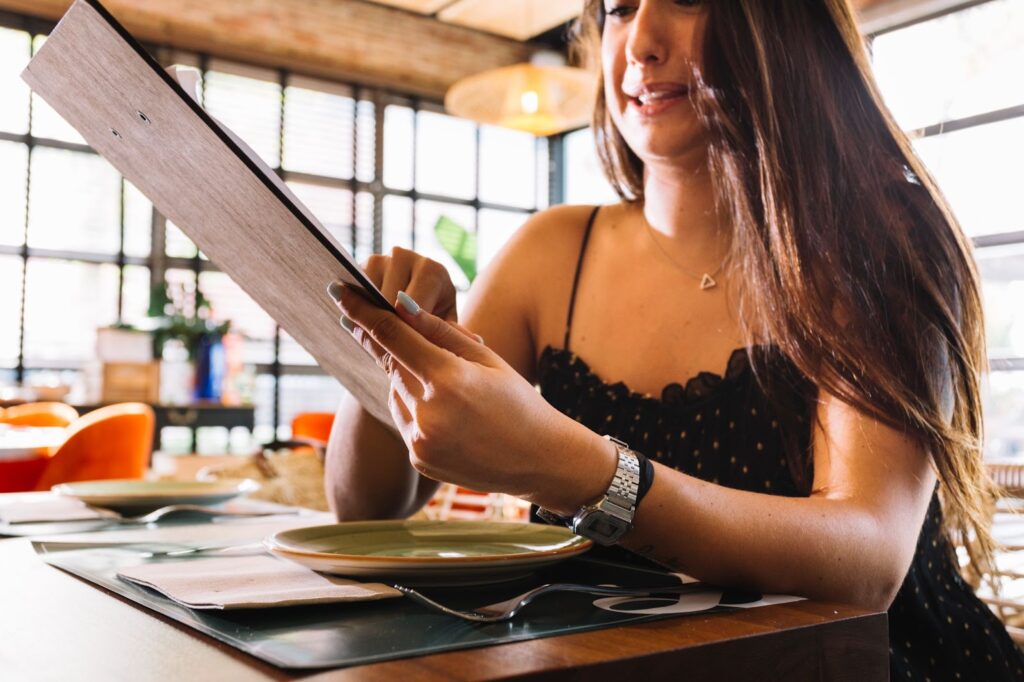 Close up of woman placing the order in the restaurant