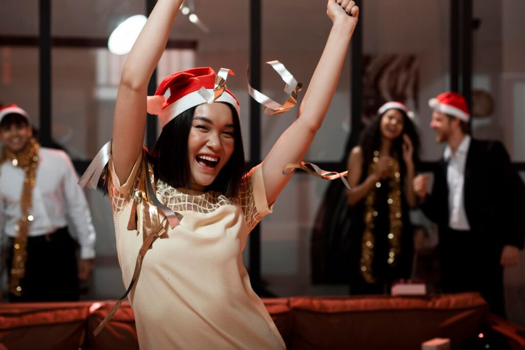 Woman wearing santa's hat partying