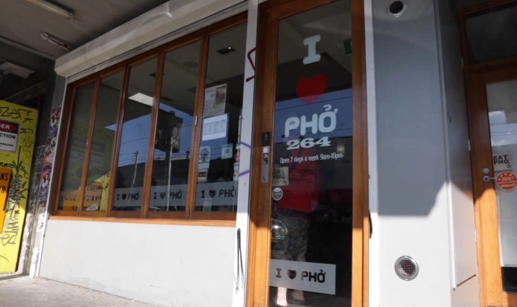 an outside view o  I Love Pho restaurant with brown glassed windows