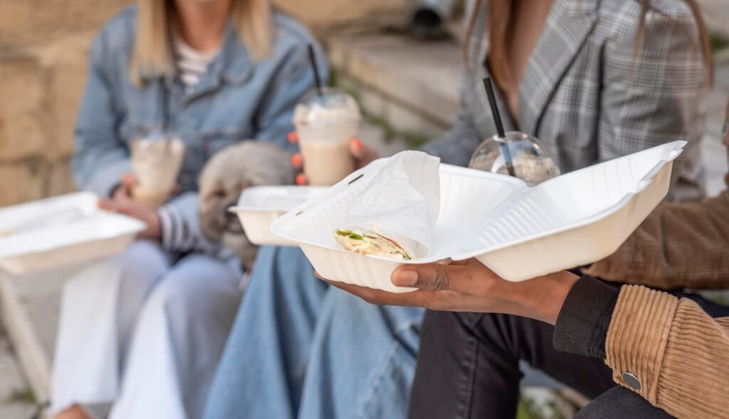 Group of people enjoying food on the street
