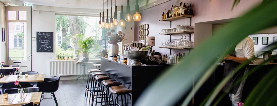 View of the cafe inside with a bar counter and seats