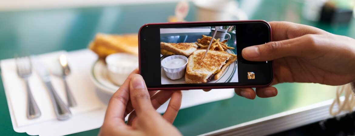 Close up on person taking photo of food